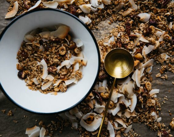 bowl beside brass-colored ladle
